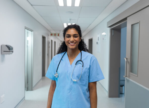 portrait-of-mixed-race-female-doctor-smiling-and-s-2025-04-05-04-10-35-utc